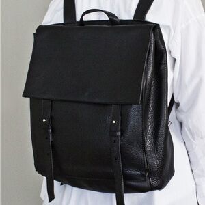 Black leather harness backpack from Le Bas. Made in Argentina